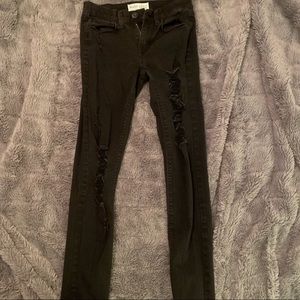 Black ripped low rise skinny jeans